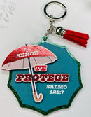 El Señor te protege - Llavero de caucho con brillantina